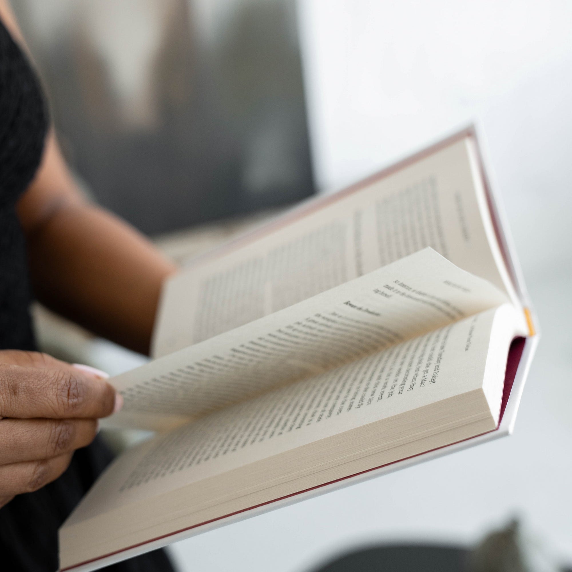 Person reading an open book
