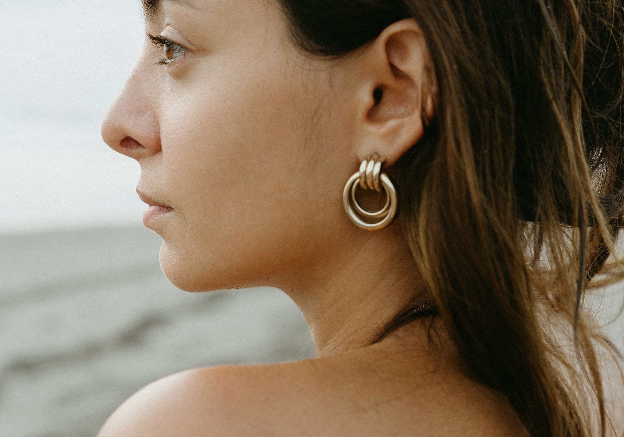 Profile of a woman with wet hair at the beach