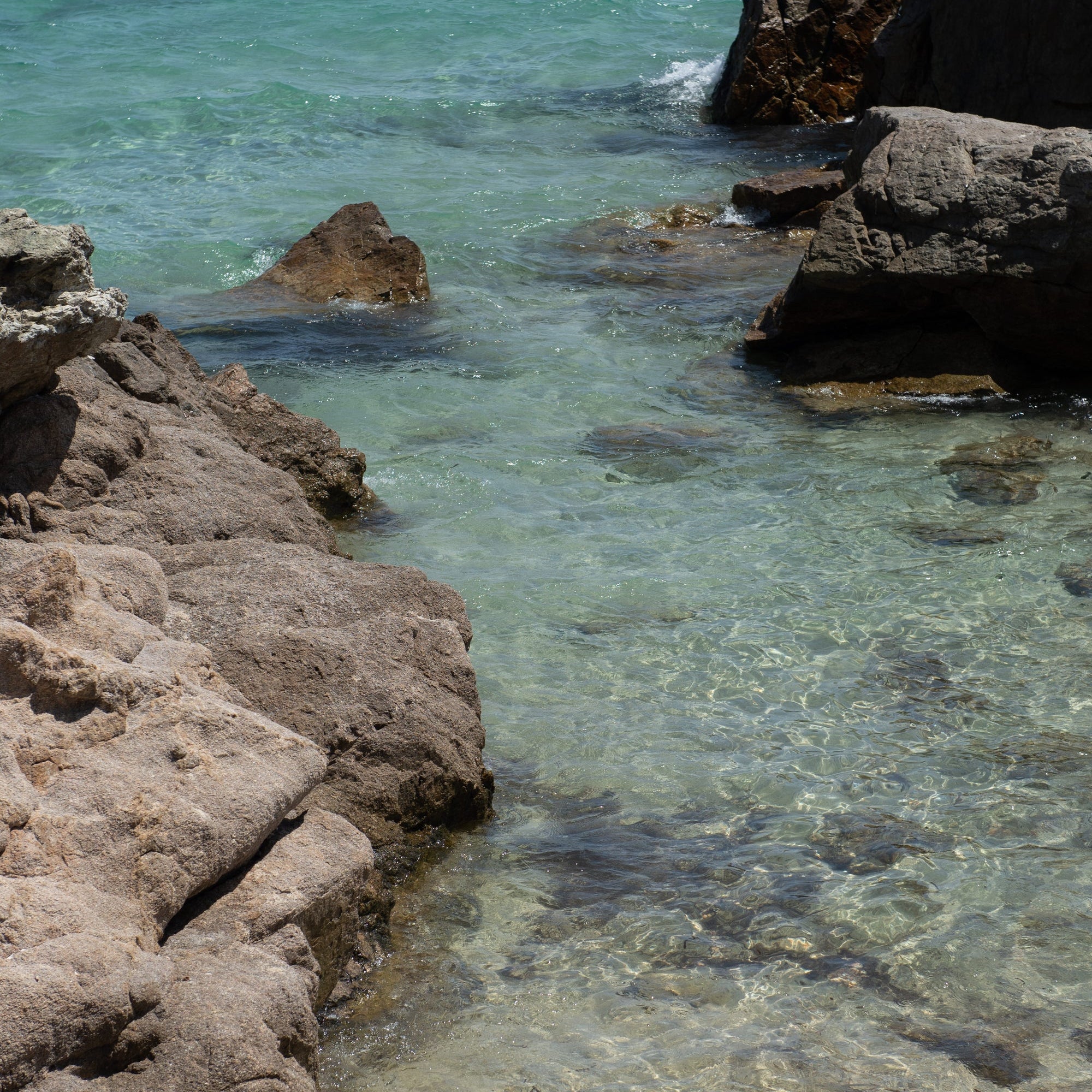 Rocky cove with clear turquoise water