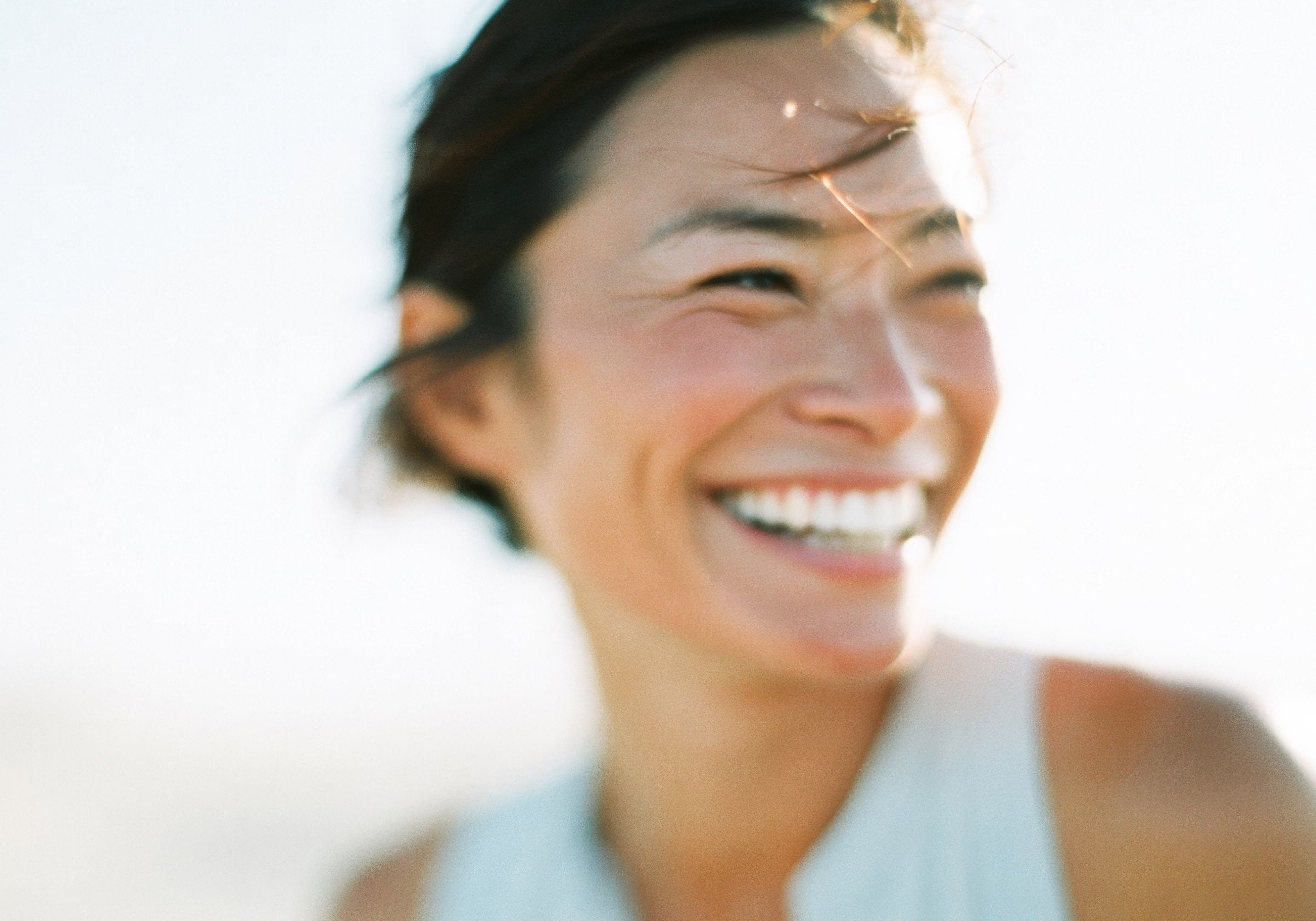 Woman smiling with radiant, healthy skin