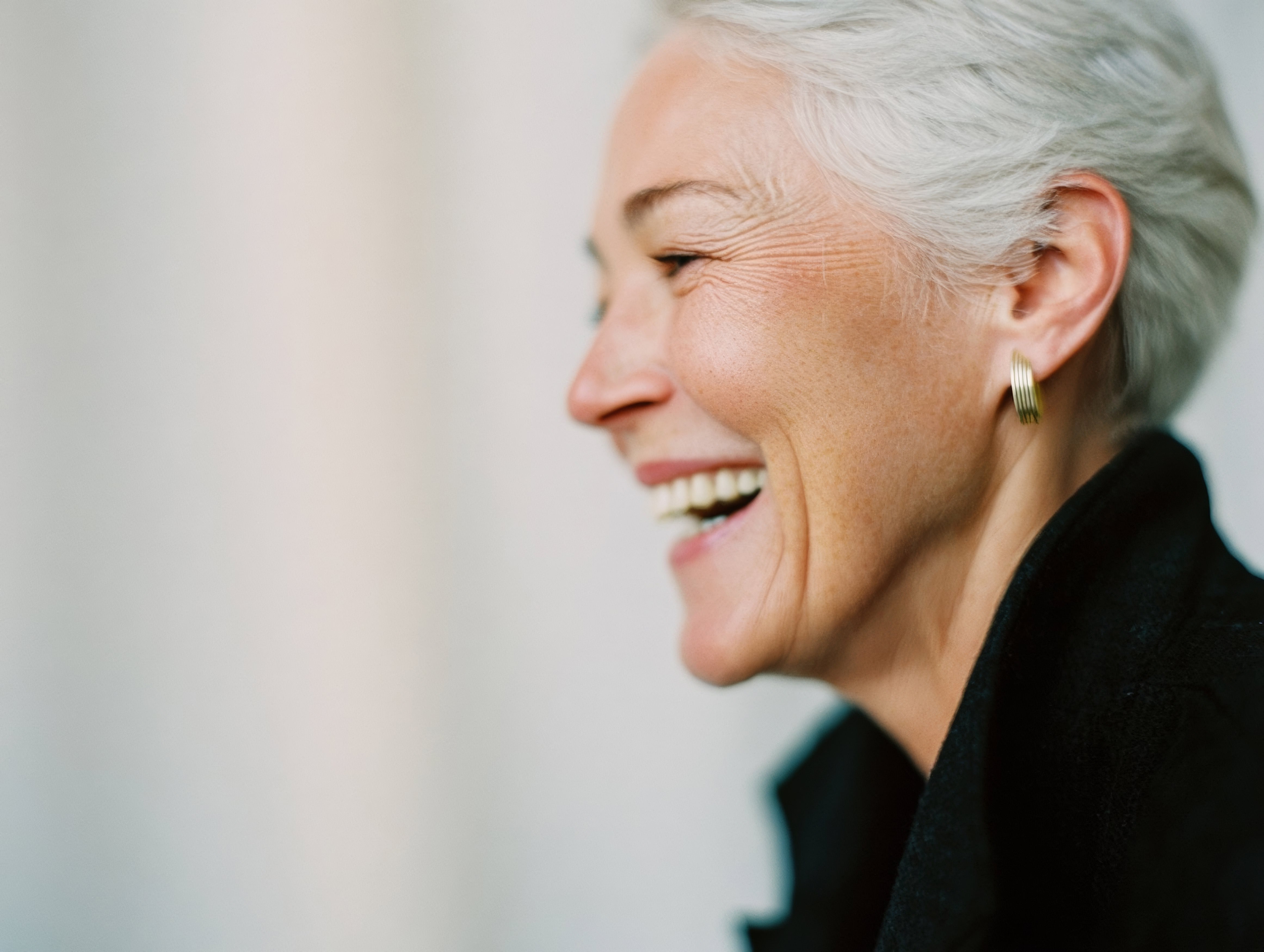 Smiling woman in profile, radiating energy and vitality