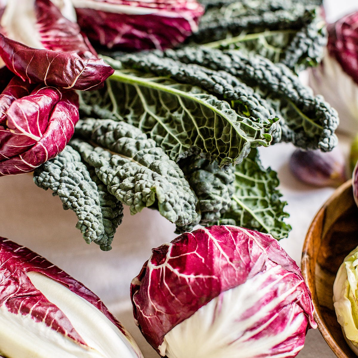 Radicchio, kale and chicory laid out on a table