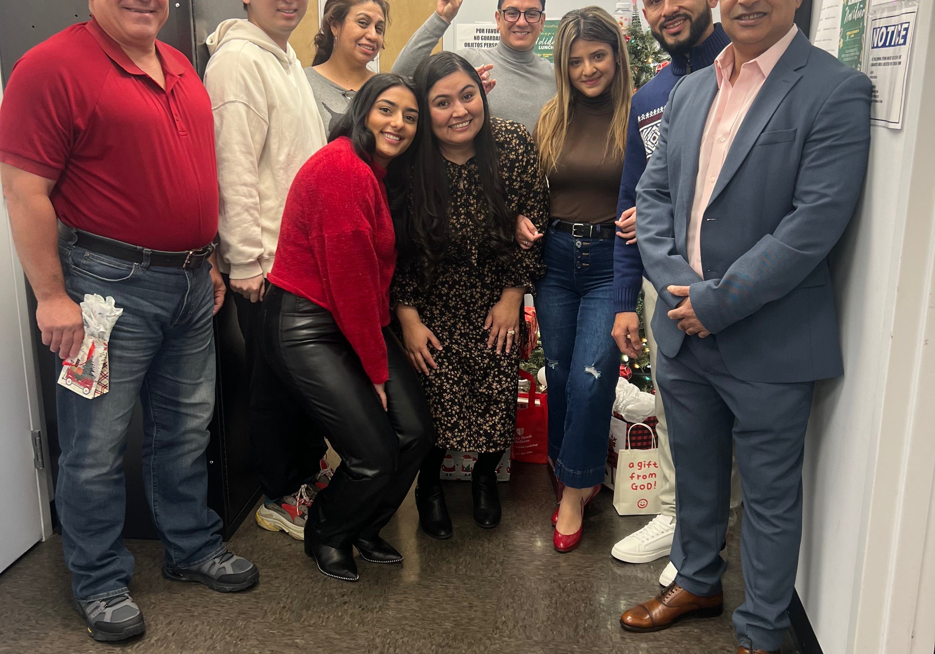 Group photo of the Vita Globe family team posing together in the office