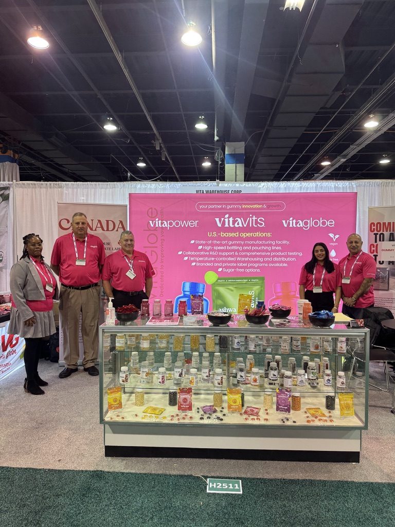 The Vita Globe team at a trade show booth