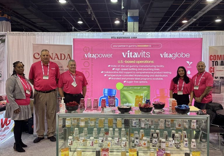 The Vita Globe team at a trade show booth