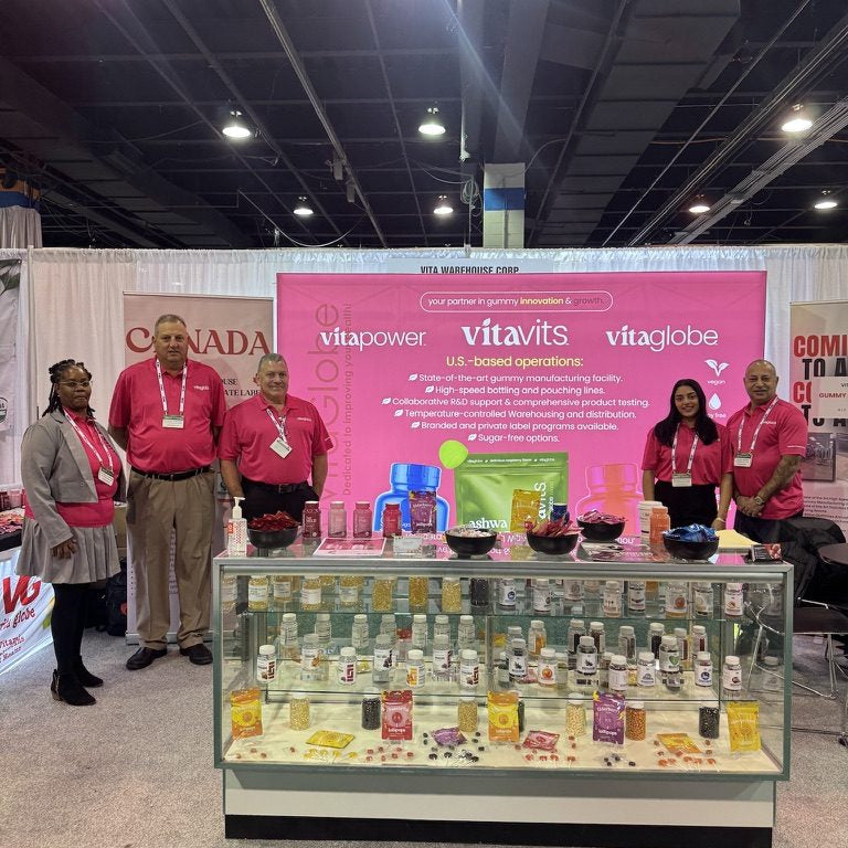 The Vita Globe team at a trade show booth