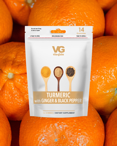 Vita-Globe turmeric supplement package with oranges in the background