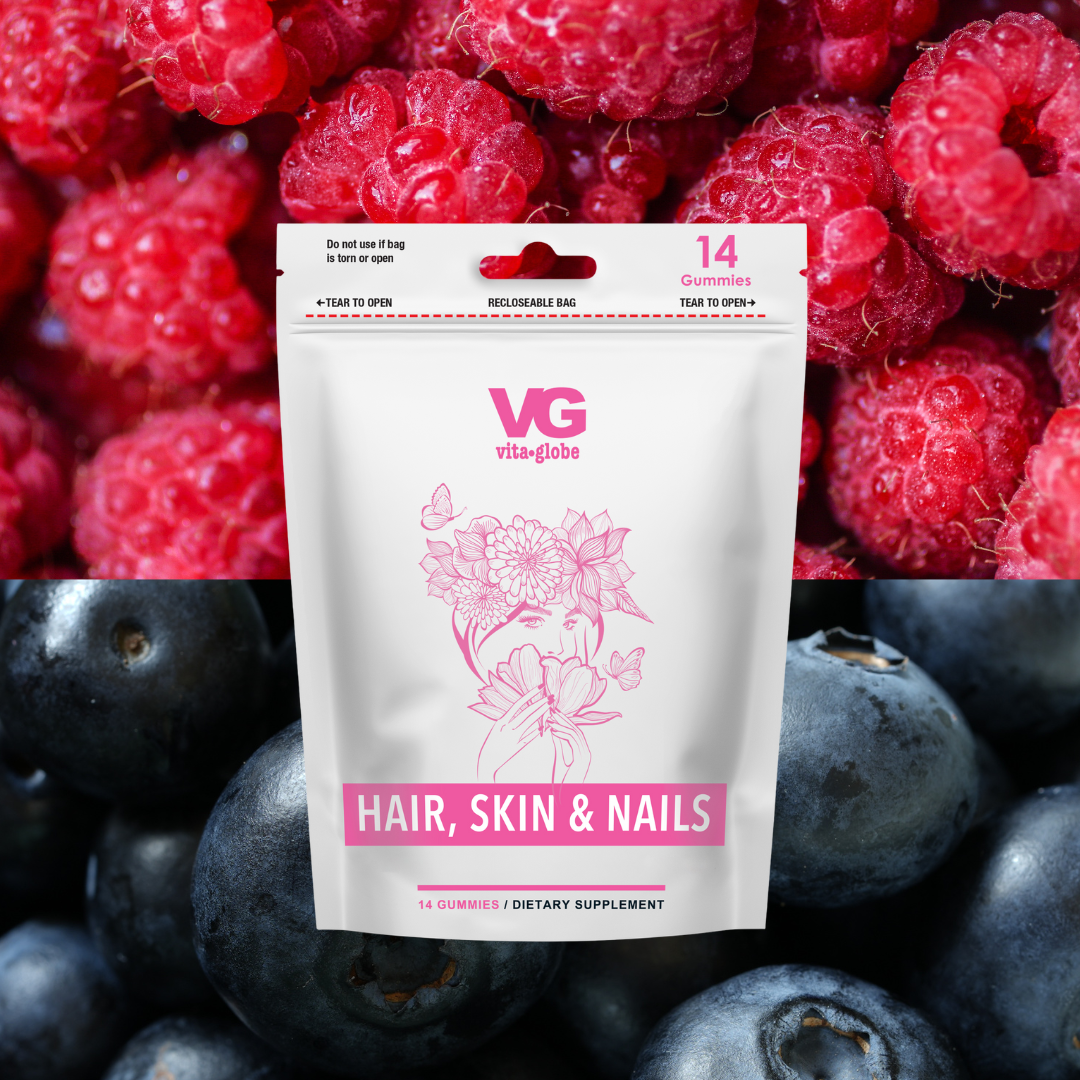 Vital Greens hair, skin, and nails supplement package surrounded by raspberries and blueberries