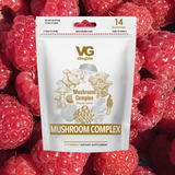 Vita Globe Mushroom Complex supplement package on raspberries