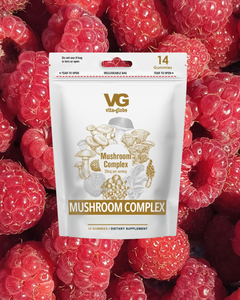 Vita Globe Mushroom Complex supplement package on raspberries
