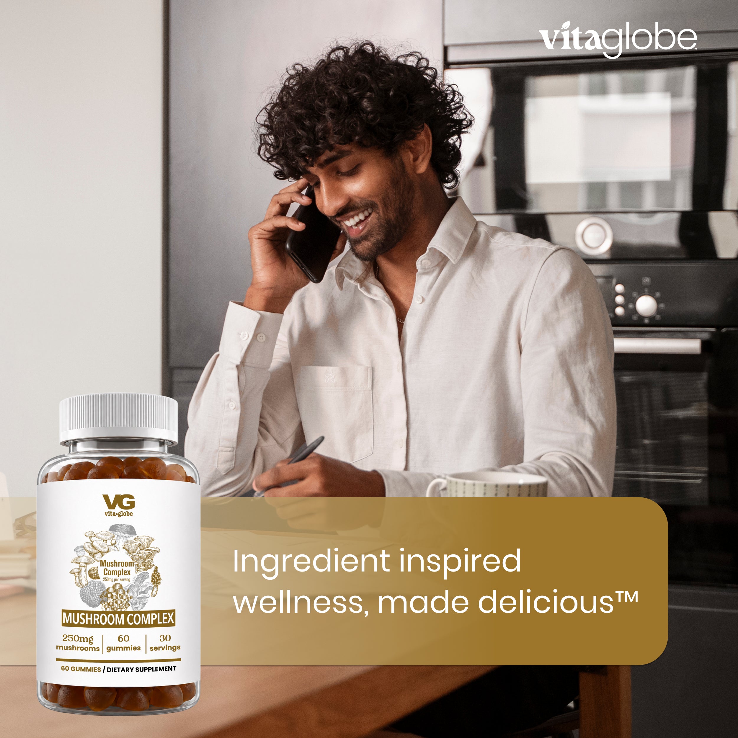 A man in a white shirt sits at a kitchen table on a phone, with a bottle of Vita globe Mushroom Complex dietary supplement in the foreground and a promotional text banner overlay.