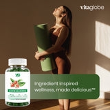 A woman in a brown bodysuit holds a rolled green yoga mat in a sunlit room, with a Vita globe Ashwagandha supplement bottle shown in the lower left and a green text banner reading 'Ingredient inspired wellness, made delicious'.