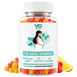 A clear plastic bottle of VG Vita-Globe Pre-Natal Vitamins gummies, filled with colorful fruit-flavored gummies and surrounded by loose gummies, raspberries, and lemon slices on a white background.