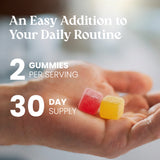 Hand holding two colorful gummies with text about serving size and supply duration.