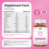 VG Gummies Supplement Facts label on a pink background, showing a white supplement facts panel with nutrition details and circular non-GMO and gluten-free badges. The product name Hair, Skin & Nails is visible at the bottom right, with VG Gummies branding and a bottle of gummies shown below.