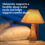 Lamp on a bedside table with text about melatonin's benefits for sleep.