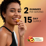 Woman smiling while eating a peach-flavored Vita Globe Turmeric+ gummy, 2 gummies per serving, 15-day supply