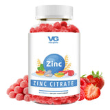 Vitaglobe Zinc Citrate gummy supplement bottle with red gummies and strawberries on a white background