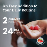 Hand holding two red gummies with text about daily routine and serving size.