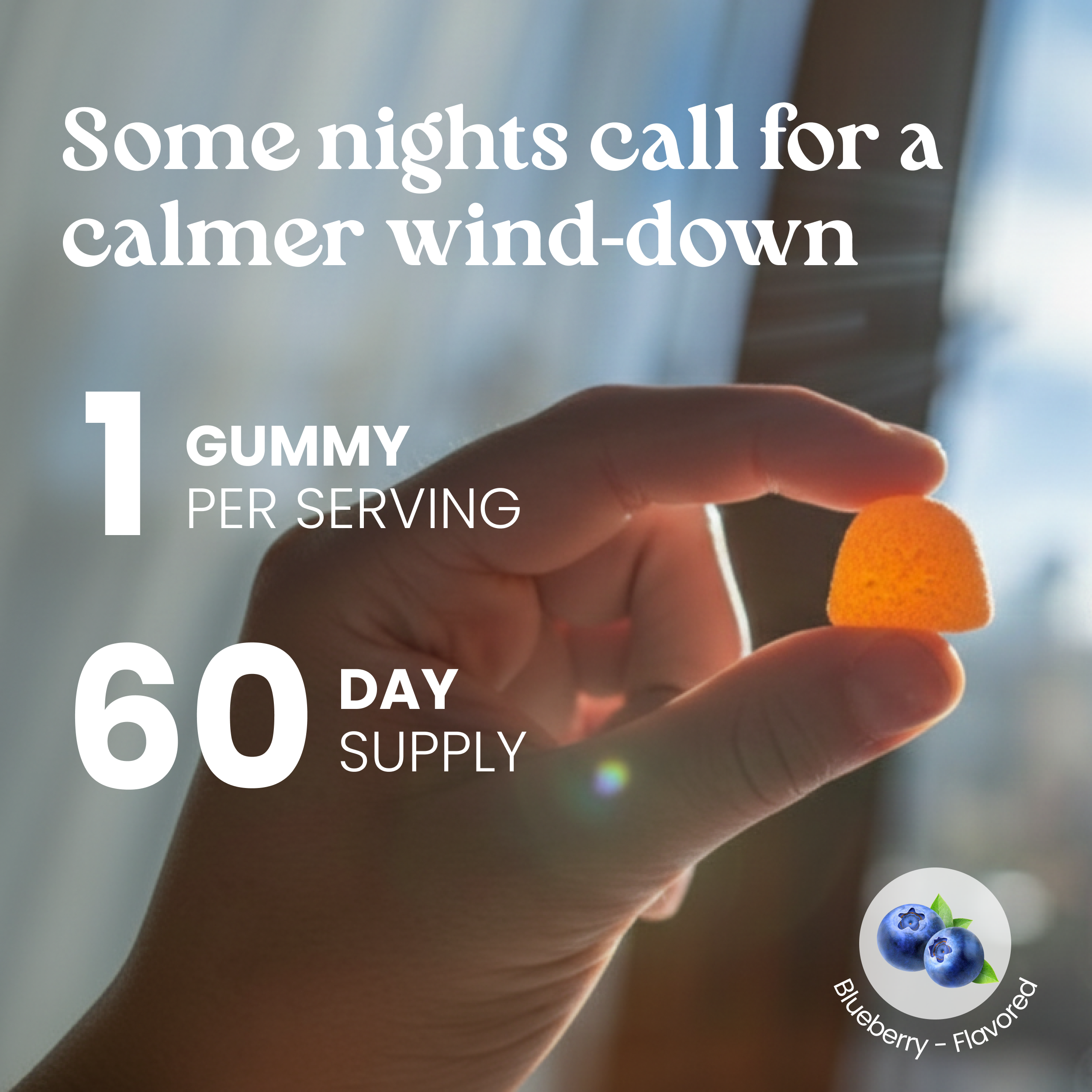 Hand holding a gummy with text about a 60-day supply and blueberry flavor.