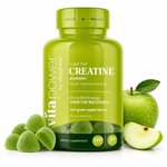 A bottle of Vita Power by Vitaglobe Creatine Gummies in tart green apple flavor, shown with green gummies, whole green apples, and apple slices on a clean white background.