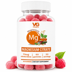 A clear plastic bottle of Vita Globe Magnesium Citrate dietary supplement gummies, filled with pinkish-red sugar-dusted gummies and shown with fresh raspberries on a white background.