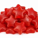A pile of glossy red star-shaped gummy candies on a plain white background.