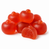 Red gummy candies shaped like small pumpkins, with one candy broken in half to show the textured gummy interior, on a white background.