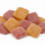 A pile of sugar-coated square gummy candies in orange and pink-red, photographed on a clean white background.