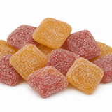 A pile of sugar-coated square gummy candies in orange and pink-red, photographed on a clean white background.