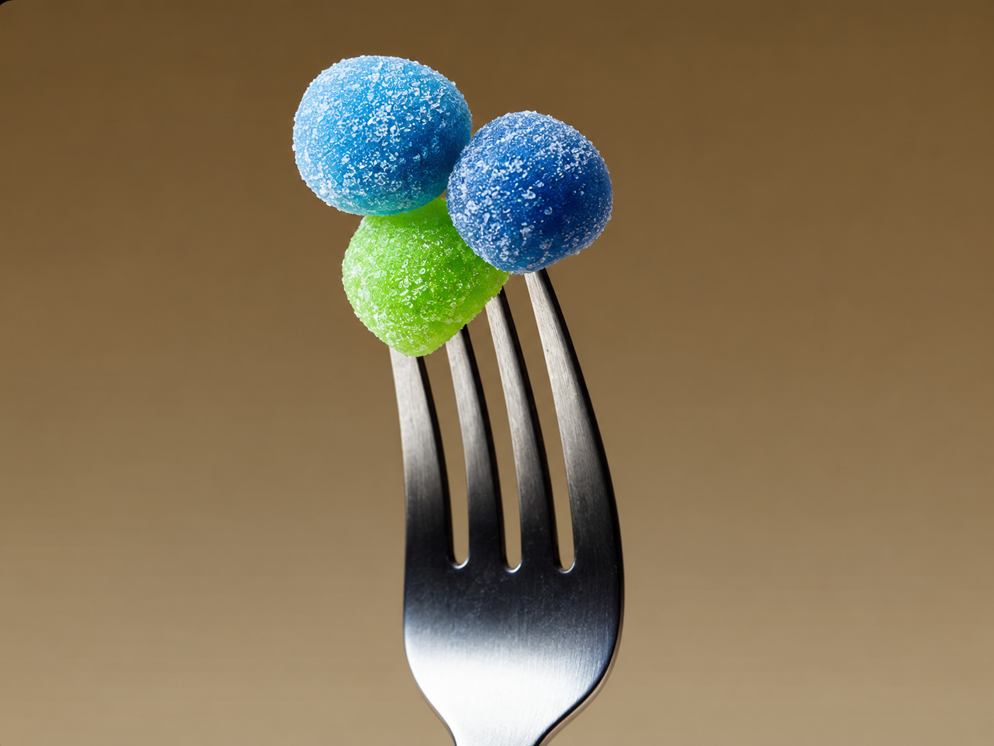 VitaPower Sugar-Free Creatine gummies in blue and green on a fork