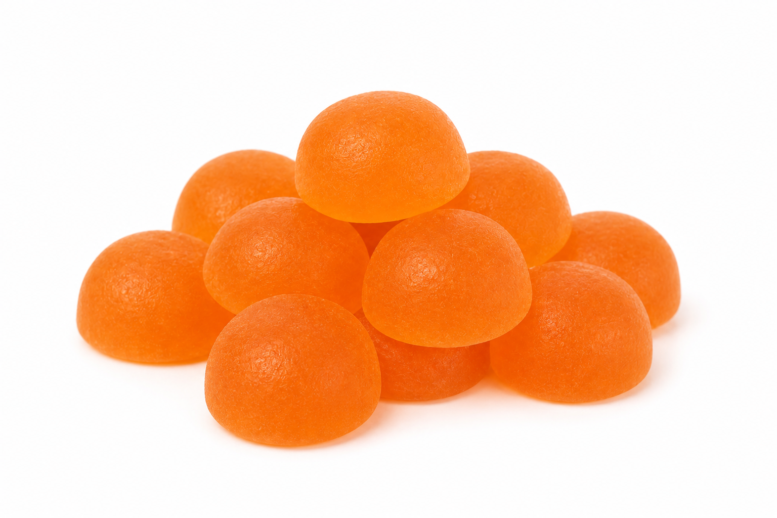 A pile of round, glossy orange gummy candies on a plain white background.