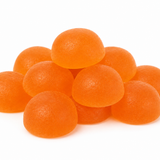 A pile of round, glossy orange gummy candies on a plain white background.