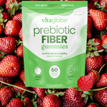 Vitaglobe prebiotic fiber gummies package surrounded by strawberries