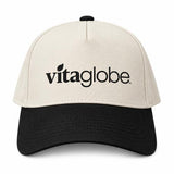 Cream and black Vita Globe baseball cap with the vitaglobe logo embroidered on the front panel.