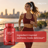 Woman jogging with a bottle of Vita Globe Apple Cider Vinegar Gummies: ingredient inspired wellness, made delicious