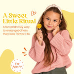 A sweet little ritual: boy enjoying a Vitalolli Manuka Soothe lollipop, for ages 4+