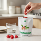 Vita-Green Ashwagandha supplement packaging with raspberries on a kitchen counter.