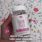 Hand holding Vita Globe Hair, Skin & Nails Gummies with Collagen — this is your sign to take your vitamins every day