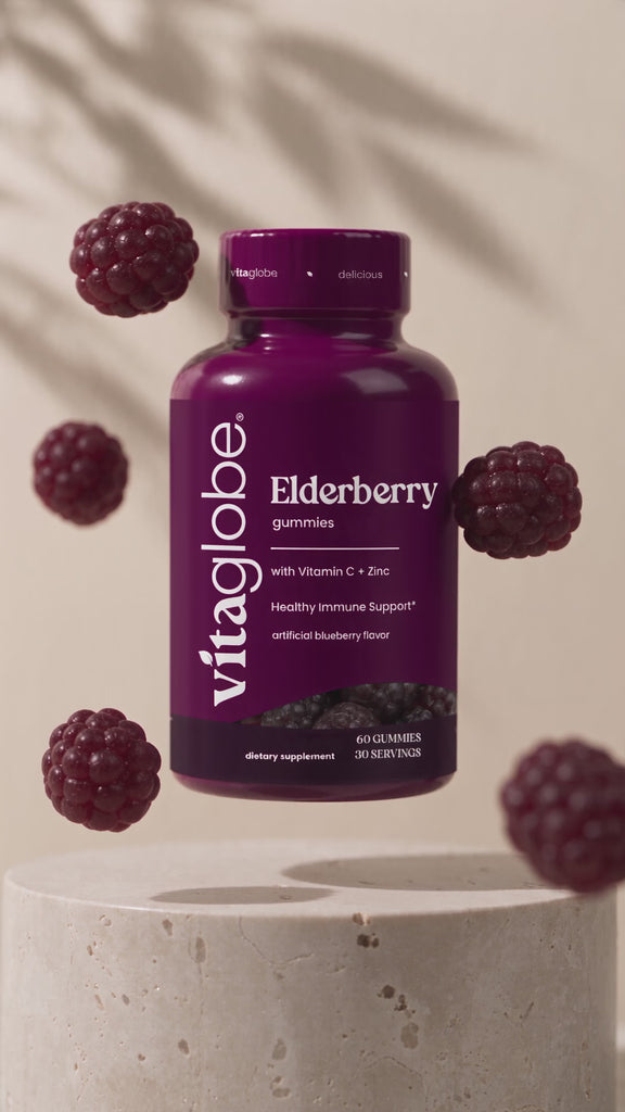 Vita Globe Elderberry gummies with Vitamin C and Zinc bottle floating with berry gummies