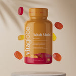 Vita Globe Adult Multi gummies bottle floating with fruit gummies