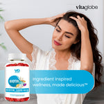 Woman with long hair next to a bottle of Vitaglobe biotin supplements.