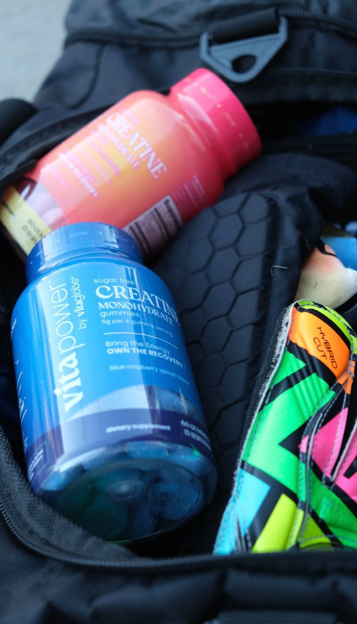 Vita Globe sugar-free creatine gummies bottles in a gym bag