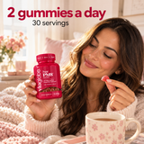 Woman relaxing with tea and a Vita Globe Her PMS strawberry gummy: 2 gummies a day, 30 servings