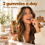 Woman eating a Vita Globe Mindful Mushrooms gummy in her kitchen: 2 gummies a day, 30-day supply