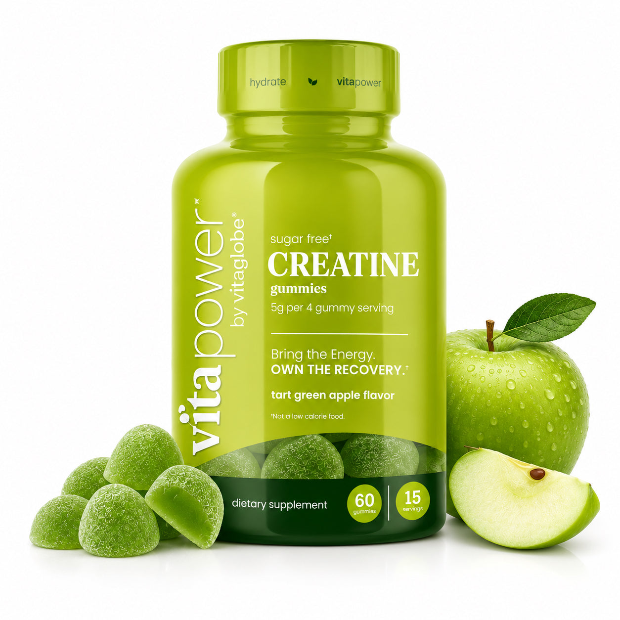 A bottle of vita power by vitaglobe creatine gummies in tart green apple flavor, styled with green gummies, a whole green apple, and a sliced green apple on a white background.